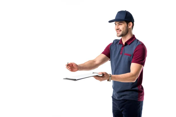 Smiling delivery man with pen and notepad isolated on white — Stock Photo