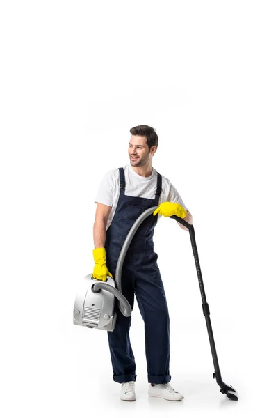 Nettoyeur en uniforme et gants en caoutchouc avec aspirateur isolé sur blanc — Photo de stock