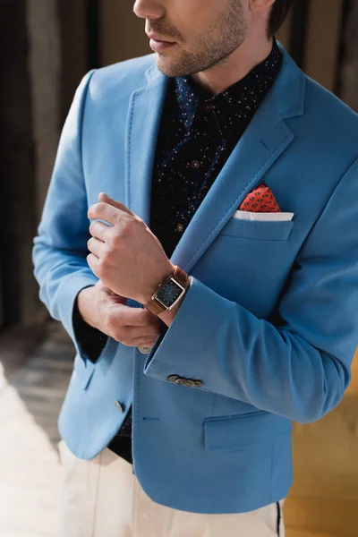 Cropped shot of man in stylish blue jacket with wristwatch — Stock Photo