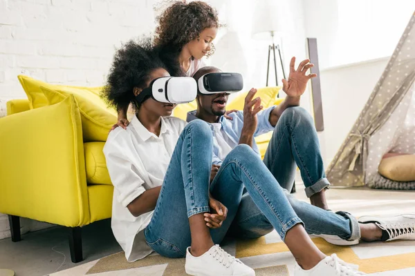 African american in virtual reality headset having fun together at home — Stock Photo