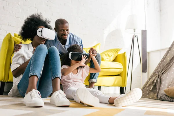 African american in virtual reality headset having fun together at home — Stock Photo