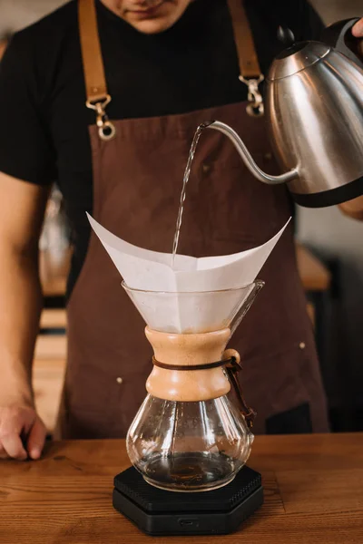 Cropped view of barista preparing filtered coffee — Stock Photo