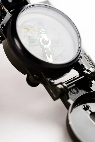 Close up of black vintage compass on white — Stock Photo