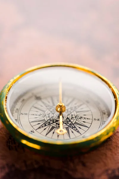 Close up of vintage compass with golden arrow — Stock Photo