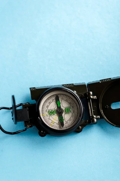 Retro and black compass on blue with copy space — Stock Photo