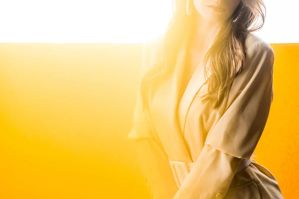 Cropped view of woman standing on orange and white — Stock Photo