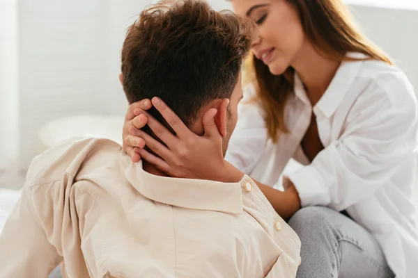 Selective focus of attractive girlfriend hugging boyfriend in shirt — Stock Photo