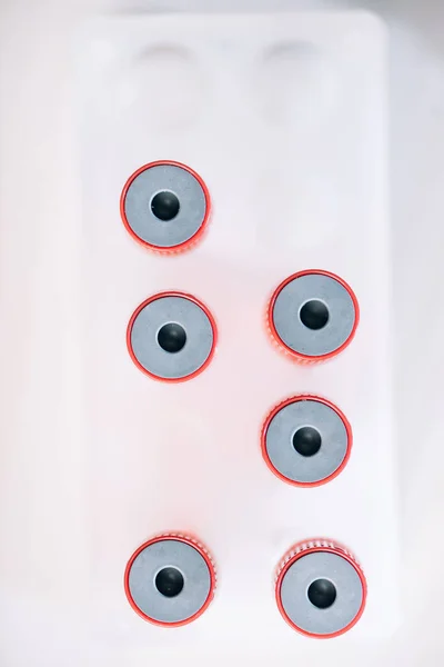 Top view of red test tubes with samples — Stock Photo