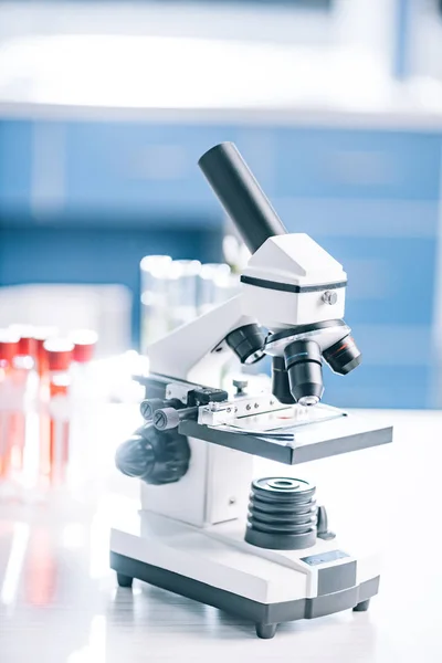 Selective focus of microscope near test tubes with samples — Stock Photo