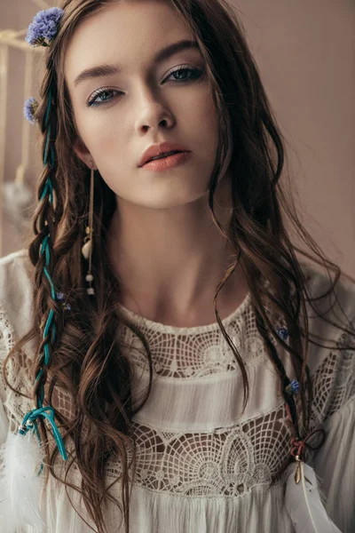 Attractive girl with braids in white boho dress on beige — Stock Photo