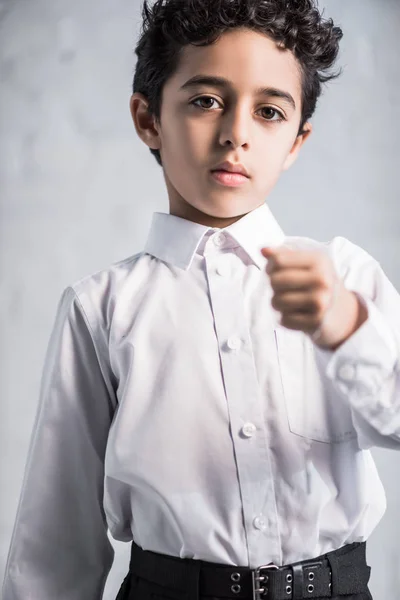 Cute jewish boy in shirt holding star of david necklace — Stock Photo