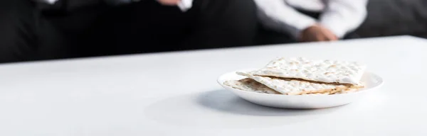 Panoramic shot of matza on plate, on wooden plate — Stock Photo