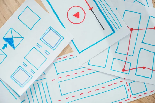 Top view of ux sketch layouts on wooden table — Stock Photo