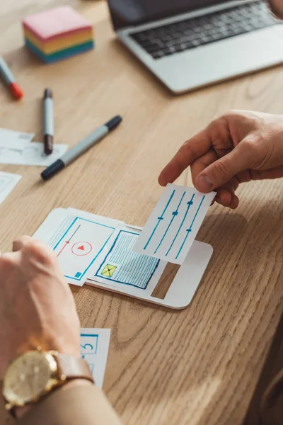Cropped view of designer creative mobile user experience design at table — Stock Photo