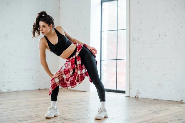 Attractive girl posing while dancing jazz funk — Stock Photo