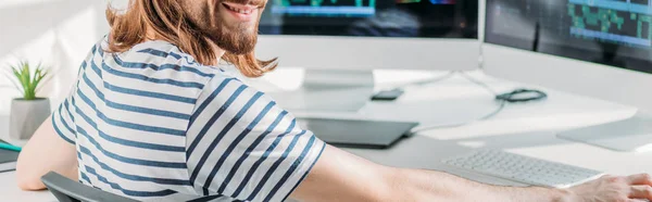 Panoramic shot of cheerful editor in studio — Stock Photo