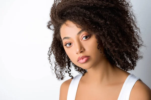 Portrait of curly african american woman, isolated on grey — Stock Photo