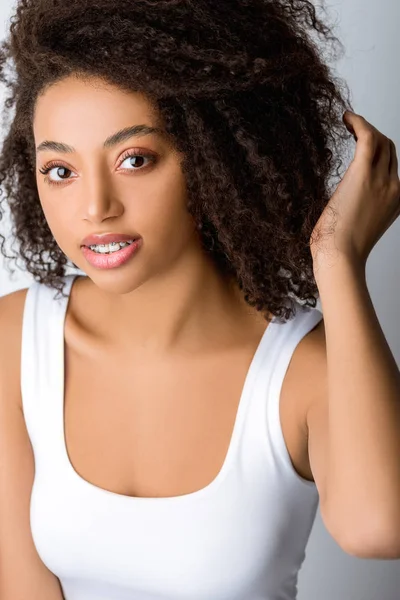 Attractive african american girl with dental braces, isolated on grey — Stock Photo