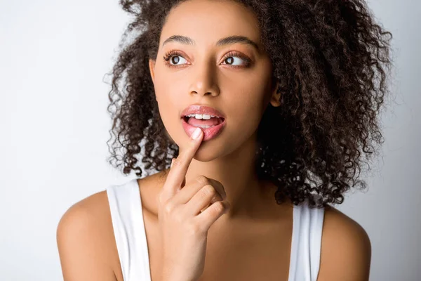 Portrait of beautiful dreamy african american girl, isolated on grey — Stock Photo