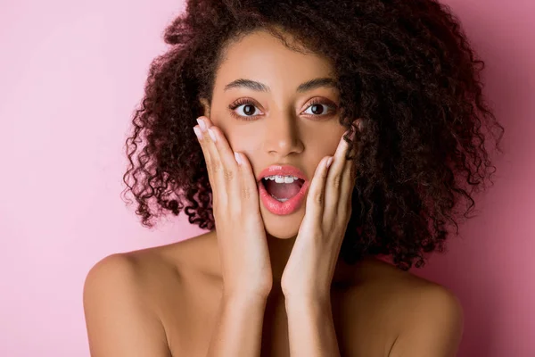 Happy shocked nude african american girl with dental braces on pink — Stock Photo