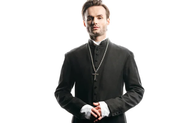 Young, confident catholic priest looking at camera isolated on white — Stock Photo