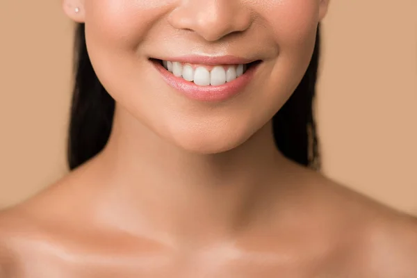 Cropped view of smiling beautiful naked asian girl isolated on beige — Stock Photo
