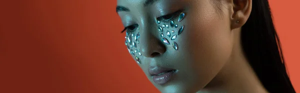 Beautiful asian girl with shiny rhinestones on face, panoramic shot — Stock Photo