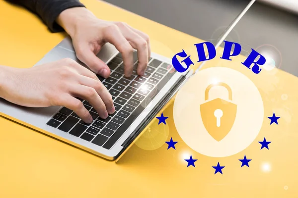 Cropped view of hacker using laptop near gdpr lettering — Stock Photo