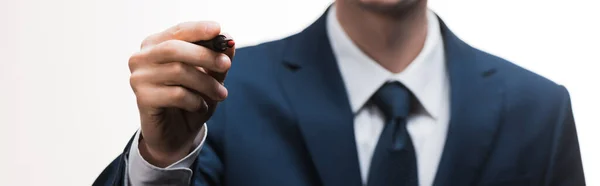 Panoramic shot of businessman in suit holding marker pen isolated on white — Stock Photo