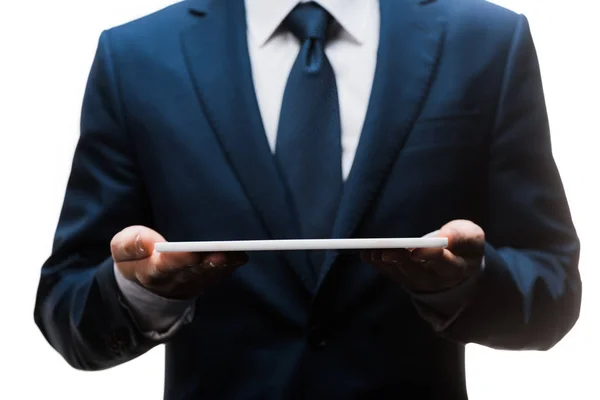 Recortado vista de hombre de negocios en traje celebración tableta digital aislado en blanco - foto de stock