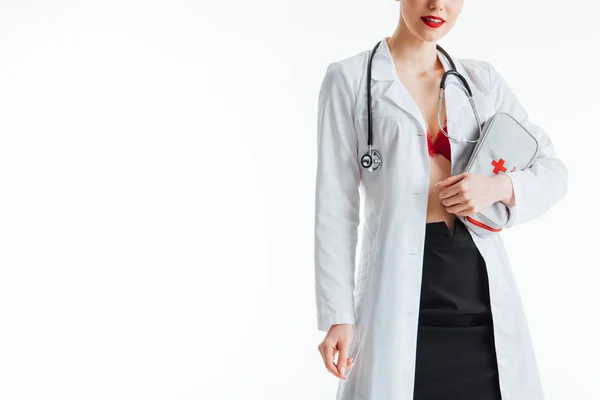 Cropped view of happy and sexy nurse holding first aid kit isolated on white — Stock Photo