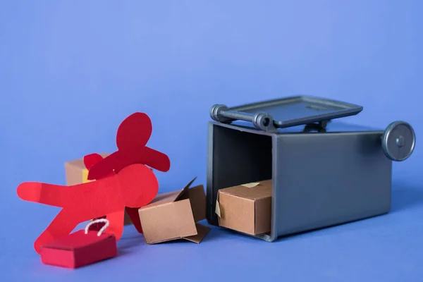 Paper people near carton boxes and trash can — Stock Photo