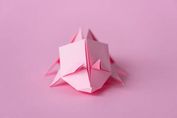 Selective focus of small origami rhinoceros on pink with copy space — Stock Photo