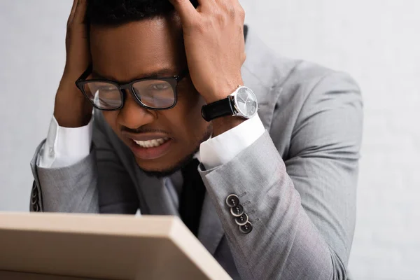 Stressed african american speaker having panic attack on business conference in office — Stock Photo