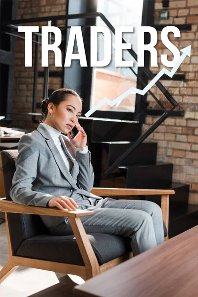 Serious asian businesswoman sitting in armchair and talking on smartphone, traders illustration — Stock Photo