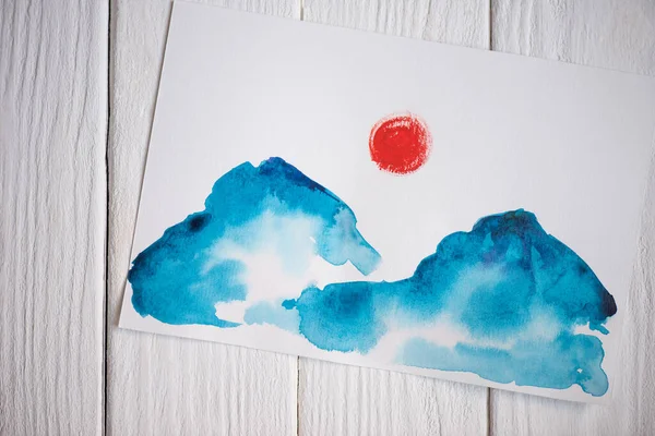 Papier von oben mit japanischer Malerei auf Holzgrund — Stockfoto