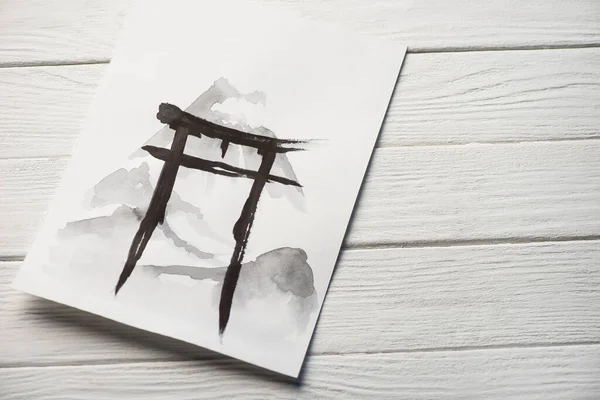 Top view of paper with japanese painting with hieroglyph on wooden background — Stock Photo