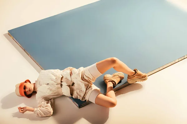 Stylish model posing for future fashion shoot on beige and blue — Stock Photo
