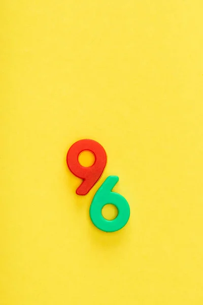 Top view of six and nine numbers on yellow background — Stock Photo