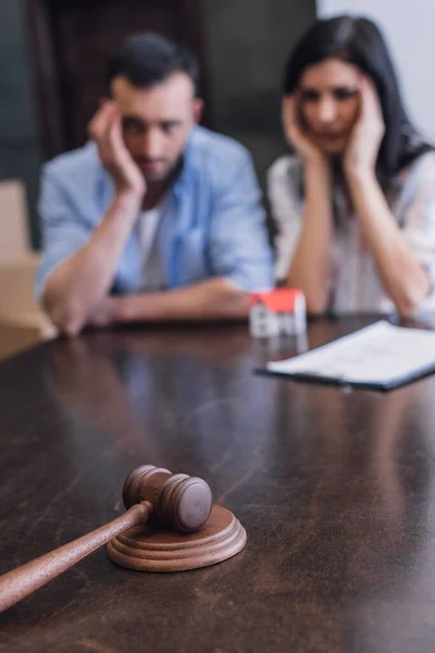 Selective focus of bankrupts at table with gavel in room — Stock Photo