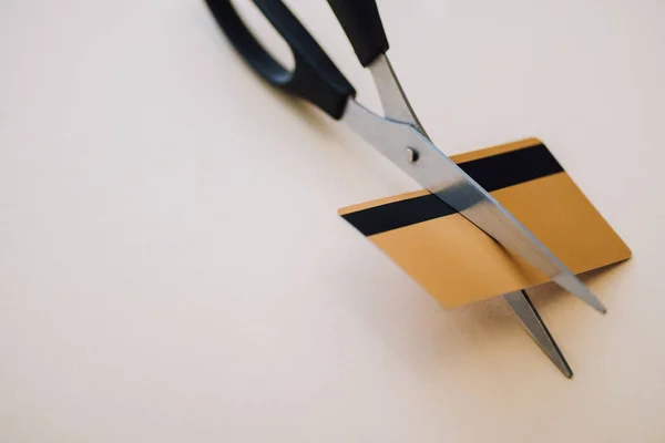 High angle view of credit card with scissors on white — Stock Photo