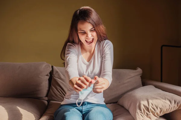 Selective focus of excited woman tearing medical mask, end of quarantine concept — Stock Photo