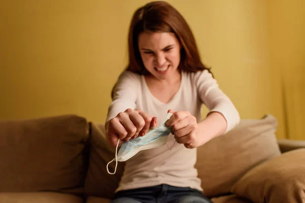 Selective focus of emotional woman tearing medical mask, end of quarantine concept — Stock Photo