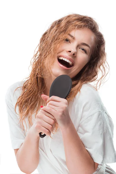 Woman singing with hair comb — Stock Photo, Image