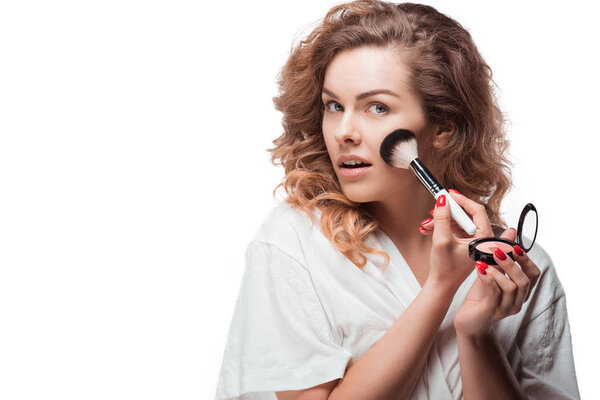 Woman applying makeup 