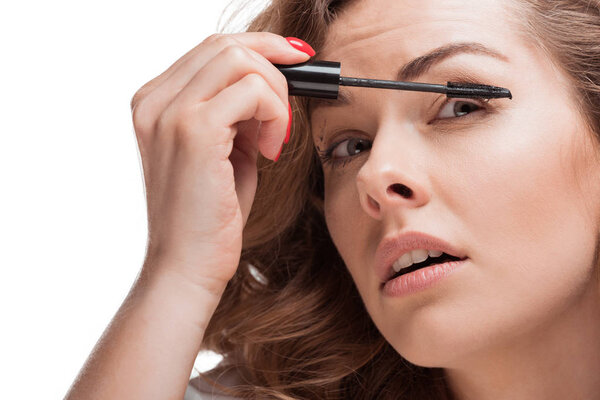 woman applying mascara