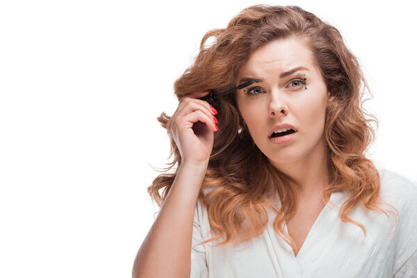 woman applying mascara