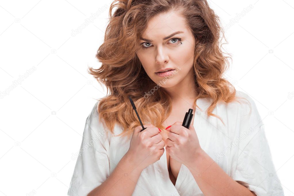 woman with mascara in hands