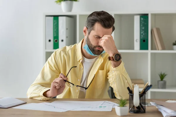 Exhausted Businessman Holding Eyeglasses Touching Face While Sitting Workplace Documents — Stock Photo, Image