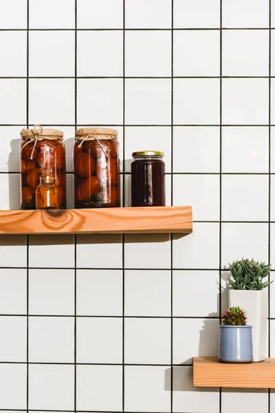 Canned Tomatoes Jars Green Plants Shelf — Stock Photo, Image